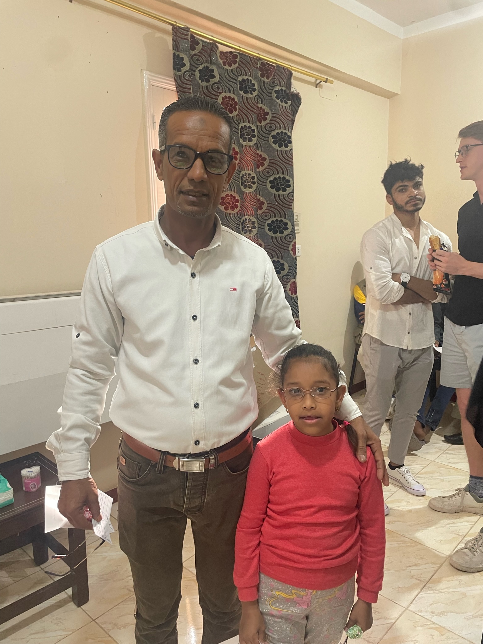 A father and his daughter with her new glasses